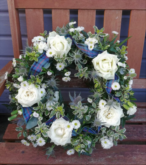 White rose and thistle wreath with tartan ribbon